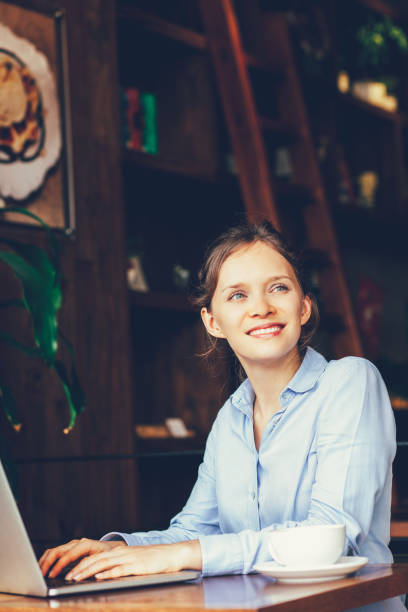 istock Dreamful woman working on laptop_tone 697134390