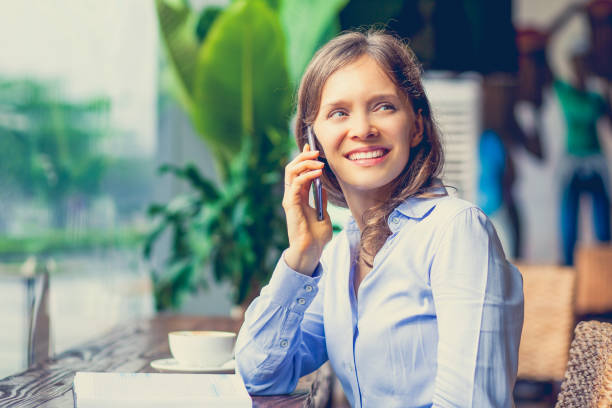 istock Positive woman having lunch in cafe_tone 697134422