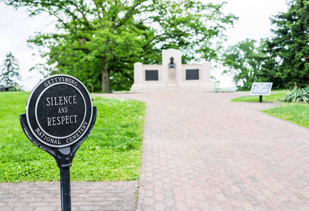 Sign in Gettysburg National Cemetery battlefield park with Lincoln Memorial and silence and respect Sign in Gettysburg National Cemetery battlefield park with Lincoln Memorial and silence and respect gettysburg national cemetery stock pictures, royalty-free photos & images