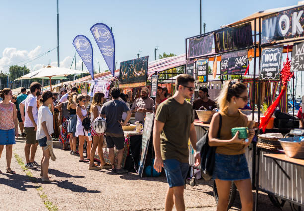 Olivos, Argentina - March 25, 2016: People at a street food market festival on a sunny day People visiting street food market called Buenos Aires Market in Olivos, Buenos Aires Province food festival stock pictures, royalty-free photos & images