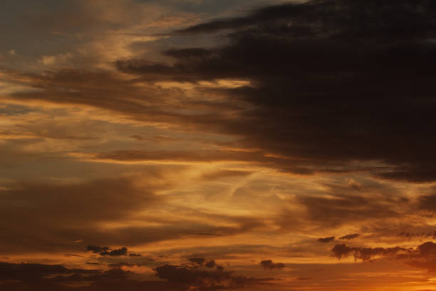 Cloud Typologies, cloudscape backlit wth sunset light Cloudscape - Sunset with scattered clouds; Cirrocumulus stock pictures, royalty-free photos & images