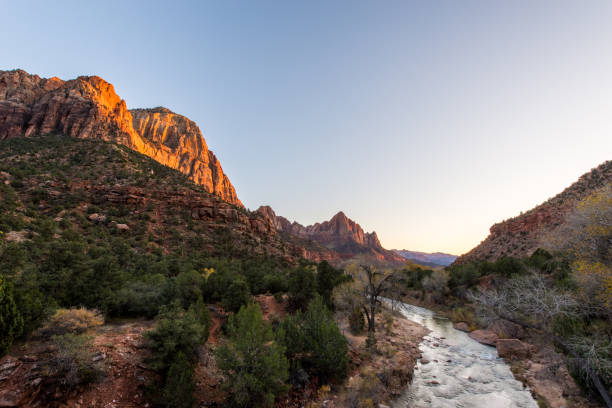 istock sun set at zion national park 697159172