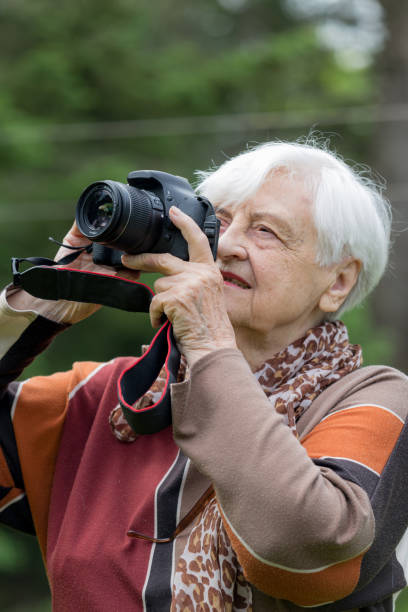 istock Senior women having fun with technology 697159448