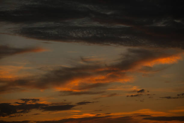 Cloud Typologies, cloudscape backlit wth sunset light Cloudscape - Sunset with scattered clouds; Cirrocumulus stock pictures, royalty-free photos & images