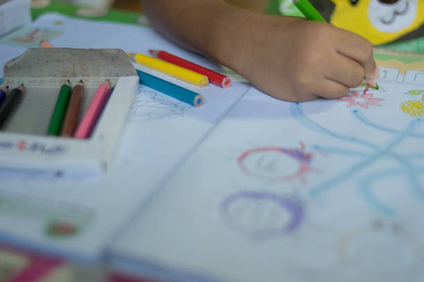 istock closeup hand child drawing picture 697165938