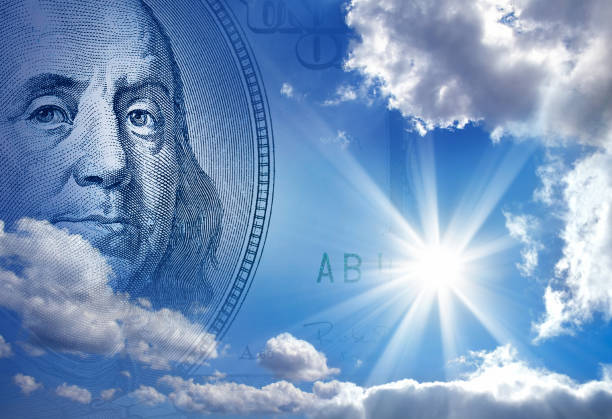 деньги в голубом небе - solar energy currency energy green стоковые фото и изображения