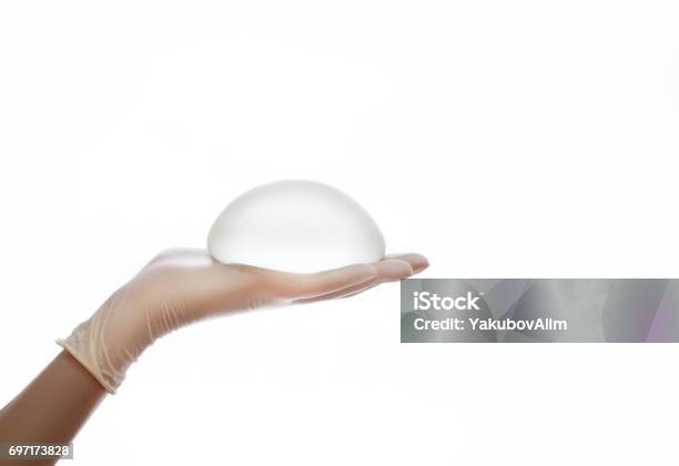 Silicone Breast Implant On Hands Stock Photo - Download Image Now - Breast Implant, Silicone, Prosthetic Equipment