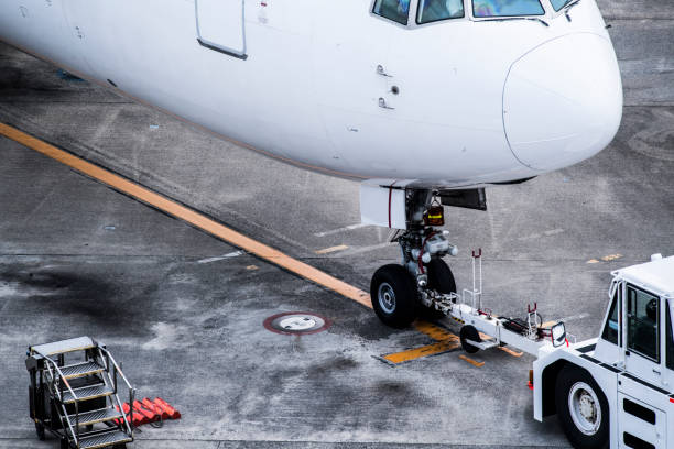 istock An airplane undergoing maintenance at the airfield. 697180742