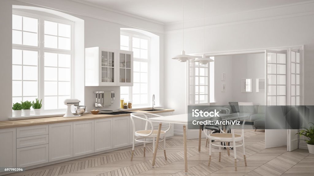 Minimalist scandinavian white kitchen with living room in the background, classic white interior design Kitchen Stock Photo