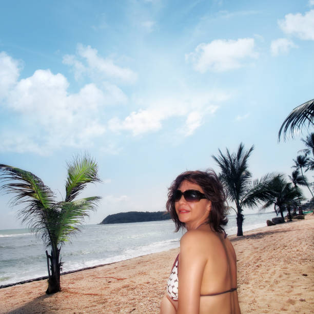 istock young woman enjoy beach 697191316