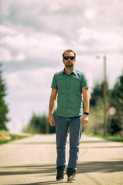 istock Attractive beautiful man walking on the road. 697191520