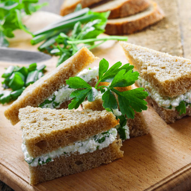 istock Cream cheese sandwiches with parsley and green onion 697200908