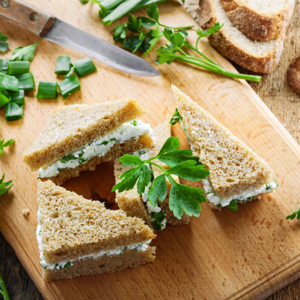 istock Cream cheese sandwiches with parsley and green onion 697200984
