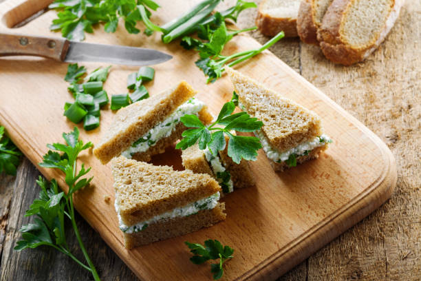 istock Cream cheese sandwiches with parsley and green onion 697201132
