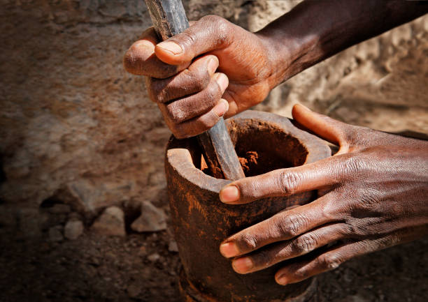 istock Making coffee powder in the mortar in Ethiopia 697203652