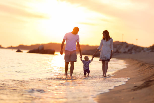 istock Family on the beach at summer 697207158