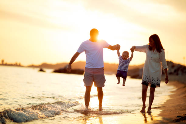 istock Family on the beach at summer 697207326