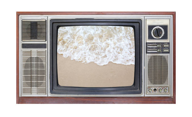 istock Retro television on white background with image of sand on the beach on screen. 697207378