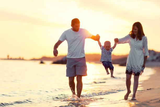 istock Family on the beach at summer 697215372