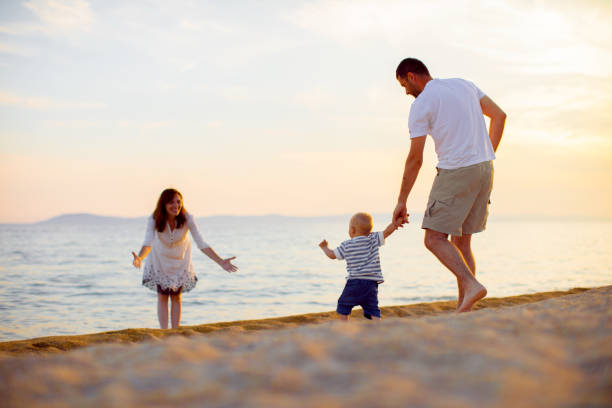 istock Family on the beach at summer 697225918