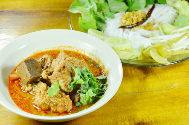 istock rice noodles and vegetable with spicy chop pork and bone red cotton tree sauce 697228758