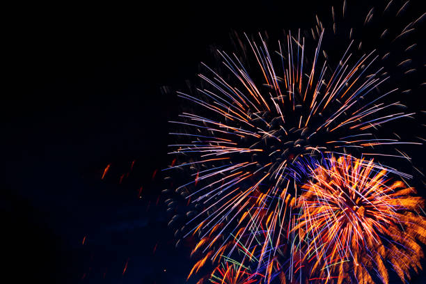 istock Brightly colorful fireworks in the night 697231542