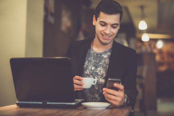 istock Working on laptop in a coffee shop 697232194