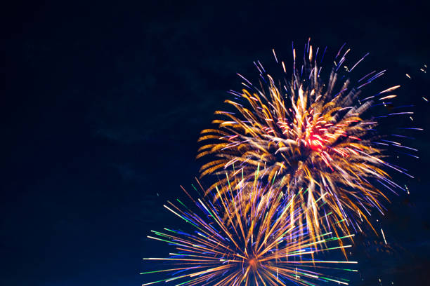 istock Brightly colorful fireworks in the night 697232300