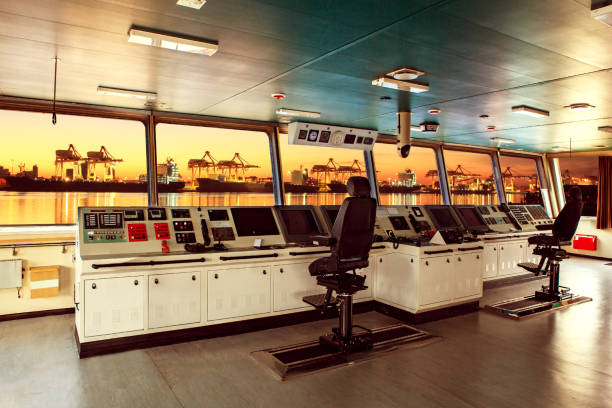 istock wheelhouse control board of modern industry ship approaching to harbor at night 697232454