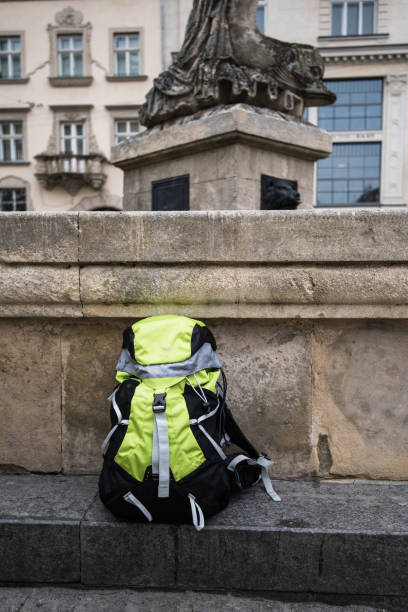 travel backpack on the awesome historic background in the european city. travel around the world concept. - bentham imagens e fotografias de stock