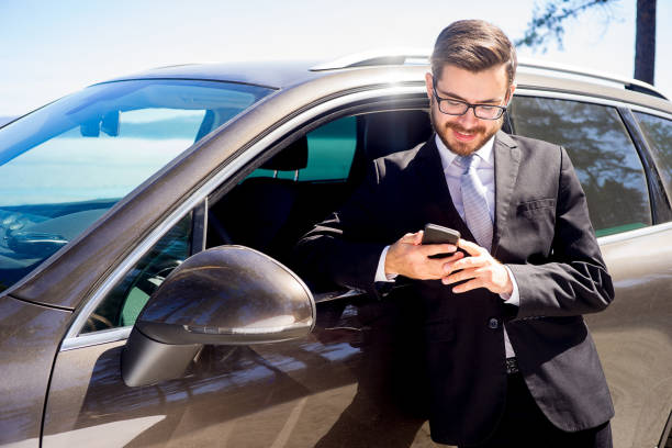istock Businessman near a car 697235972