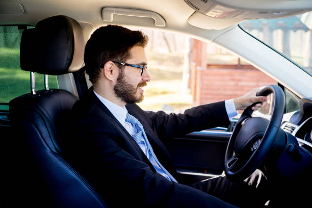 istock Businessman sitting in a car 697236462