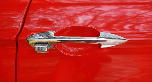 istock Close-up Chromed handle of red classic vintage car. 697238822