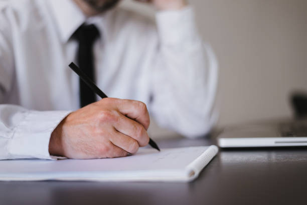 istock Writting on empty sheet of paper 697238956
