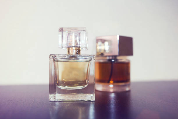 istock Two bottles of perfume on the table. 697239894
