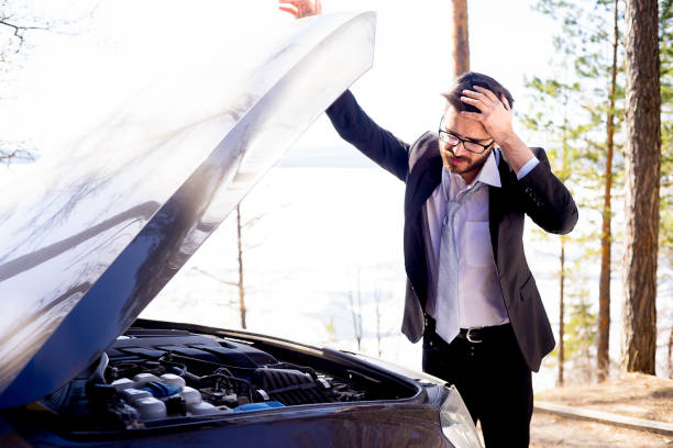 Stressed man had a car accident A stressed man had a car accident vehicle breakdown stock pictures, royalty-free photos & images