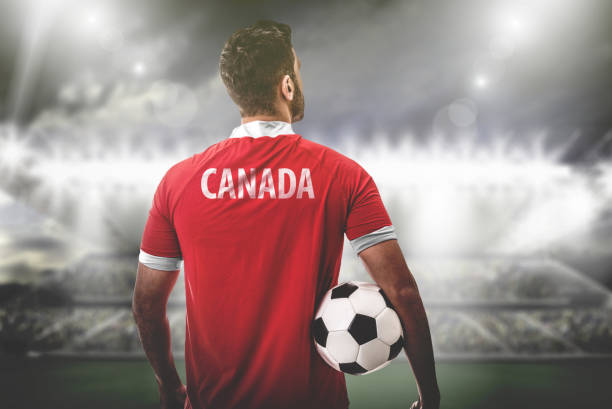istock Canadian Fan / Sport Player on uniform celebrating 697249490