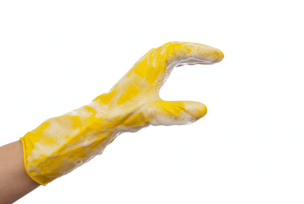 istock Hand in yellow rubber glove 697249728