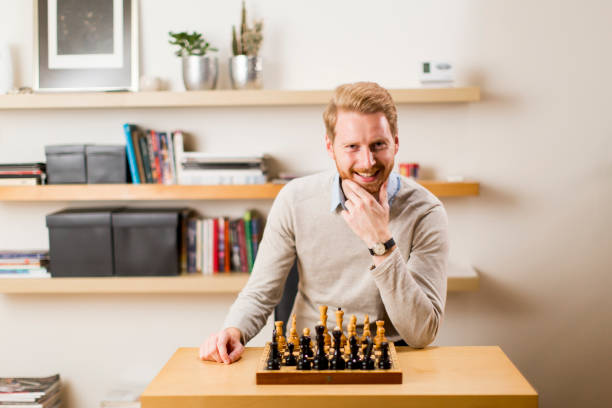 Portrait of a happy man playing chess