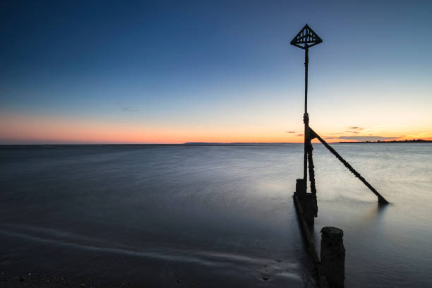 Beautiful Spring sunset long exposure beach landscape