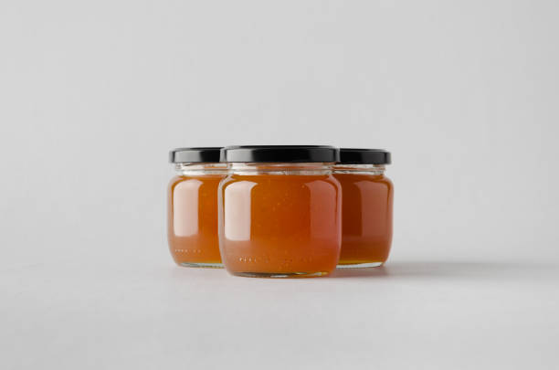 istock Apricot Jam Jar Mock-Up - Three Jars 697264262
