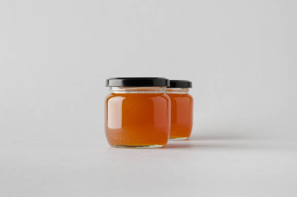 istock Apricot Jam Jar Mock-Up - Two Jars 697264562