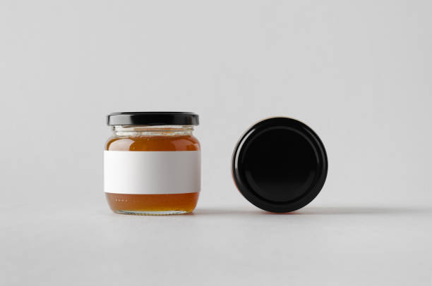 istock Apricot Jam Jar Mock-Up - Two Jars. Blank Label 697266826