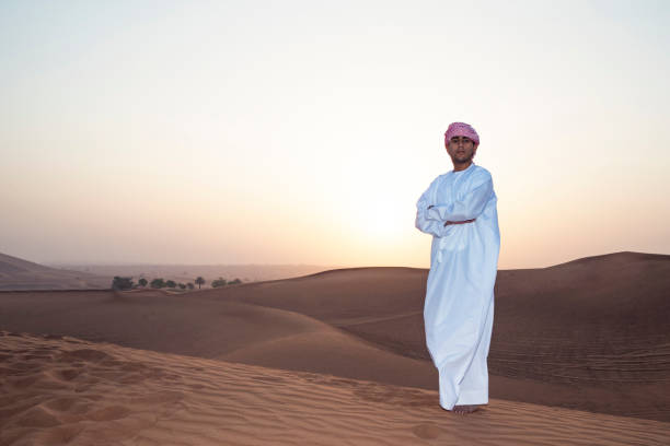 istock Arab admiring the the dunes of Arabia 697267588