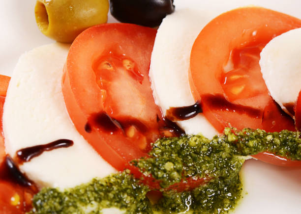 istock Tomatoes and mozzarella cheese sliced olives 697274976