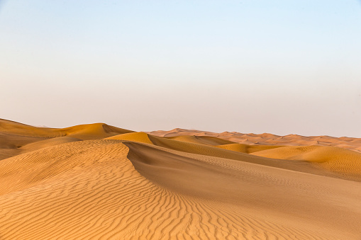 Close up views of the sand dune peaks hills and valleys and footsteps