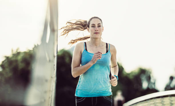 istock Female Athlete Running Outdoors 697278404