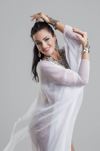 istock Young belly dancer woman dancing 697281576