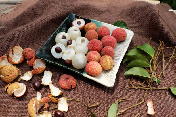 istock plate of fruit, litchi with juicy pulp 697284908