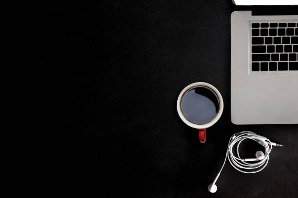 istock Special workspace. laptop, coffee on a dark leather background. 697285256